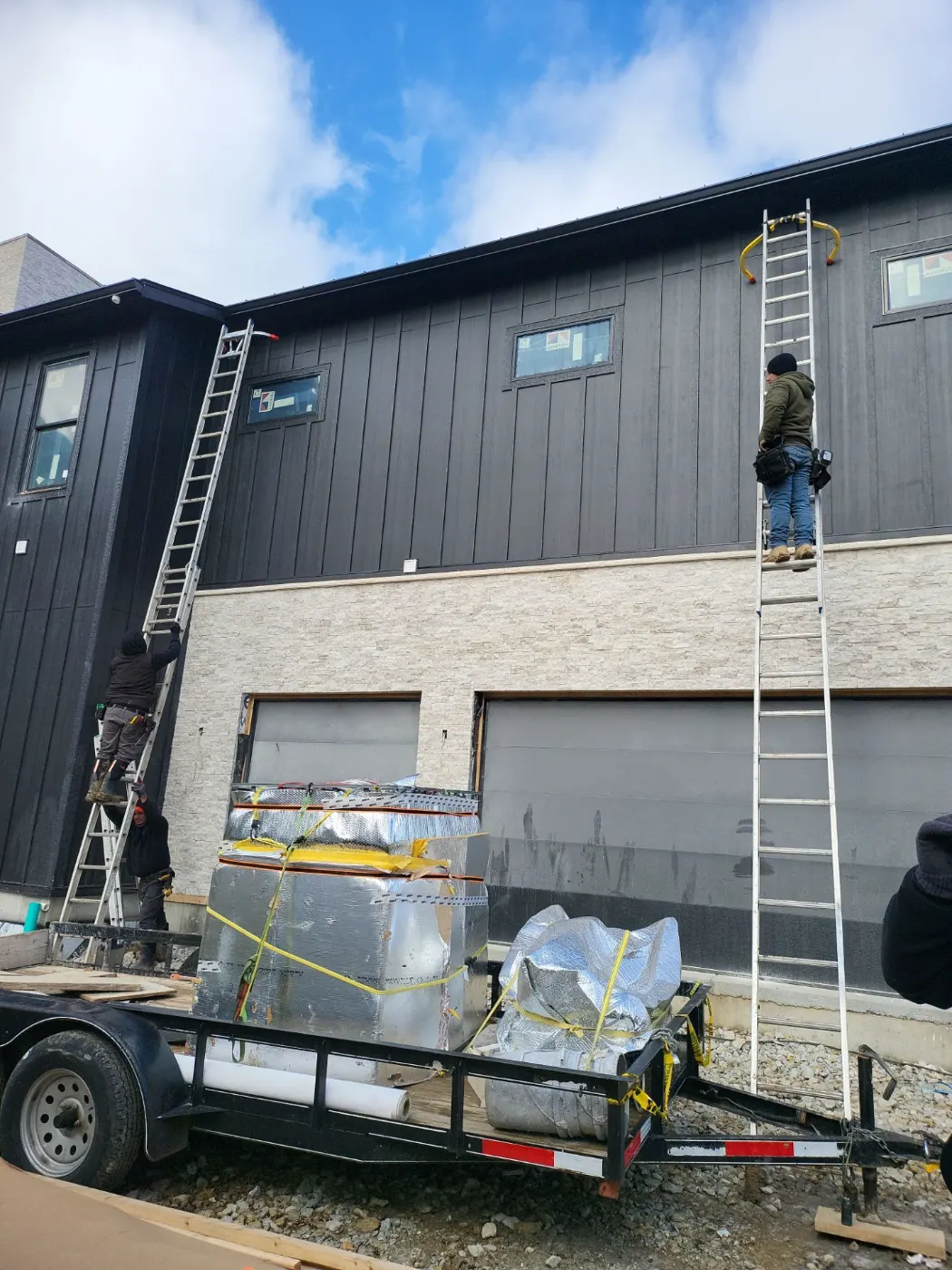 Siding installation documented in Stones Crossing